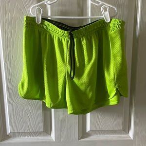 Green mesh athletic shorts